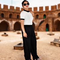 White Knitted Crop Top with Black Trousers