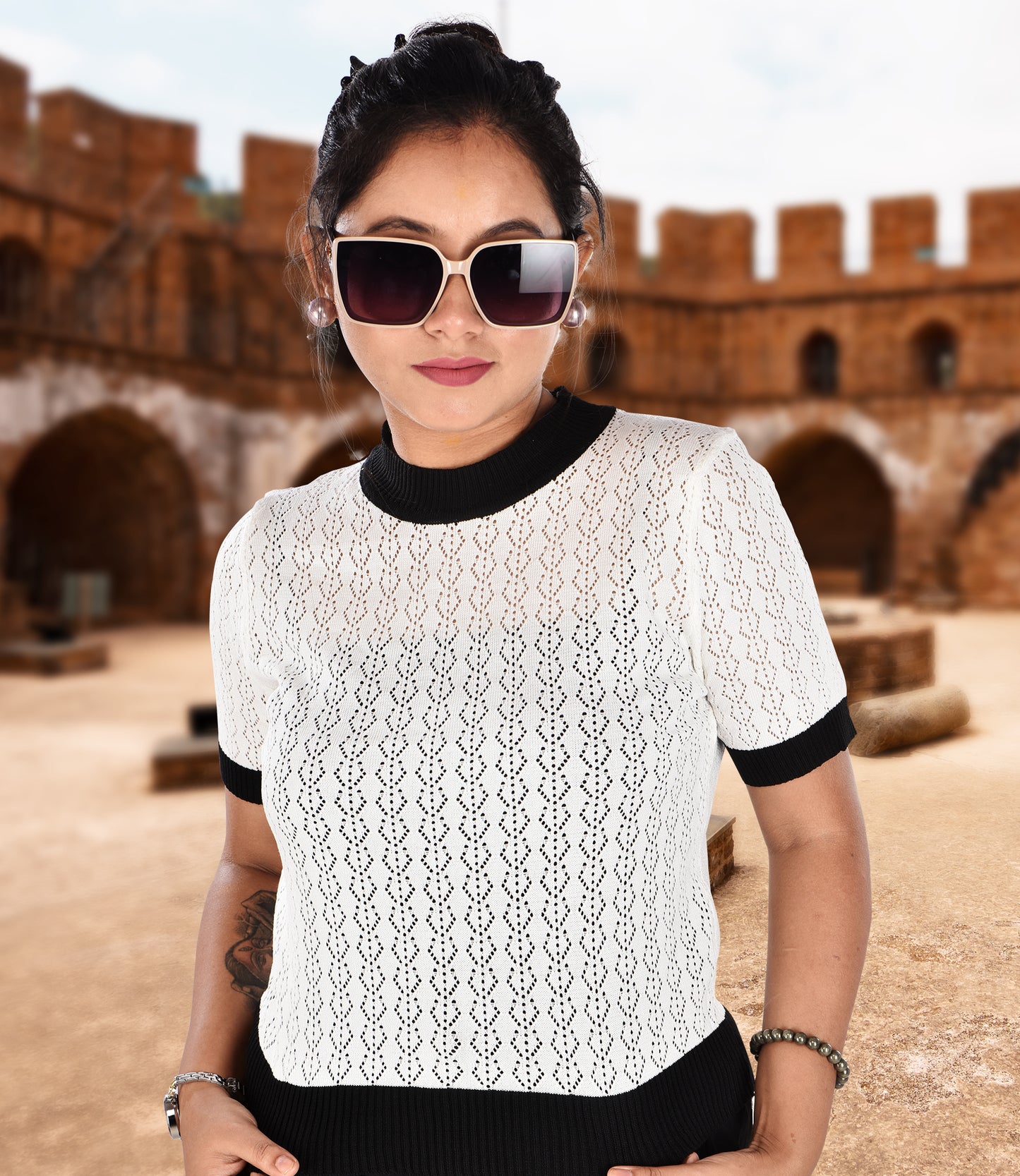 White Knitted Crop Top with Black Trousers