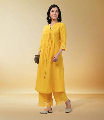 Yellow Muslin Solid Pleated A-Line Kurta Set