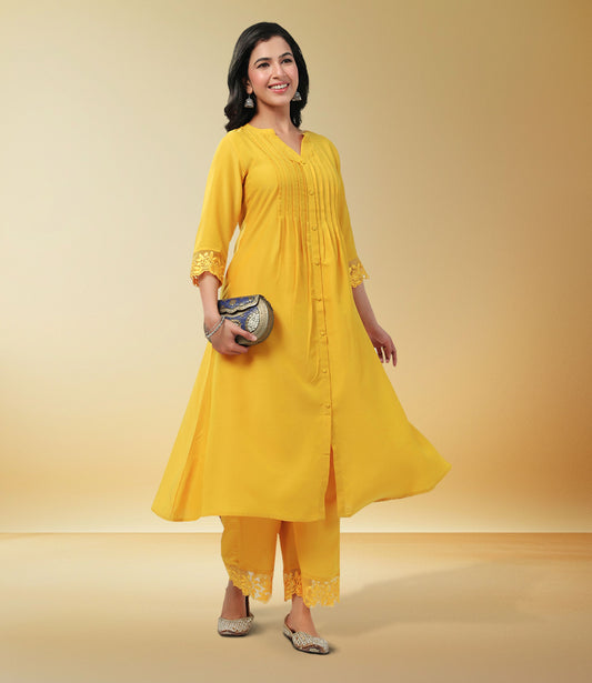 Yellow Muslin Solid Pleated A-Line Kurta Set