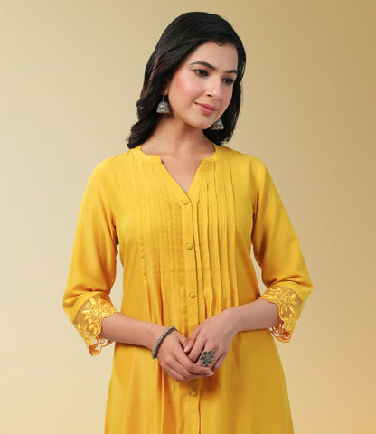 Yellow Muslin Solid Pleated A-Line Kurta Set